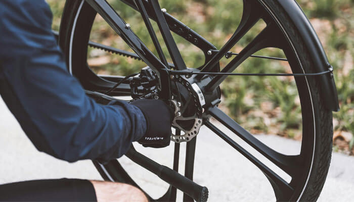 a person testing and maintaining an electric bike