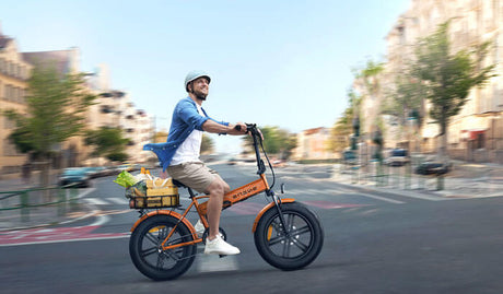 a person riding an engwe ep-2 boost folding electric bike on the road