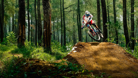  a man cycling on a slope