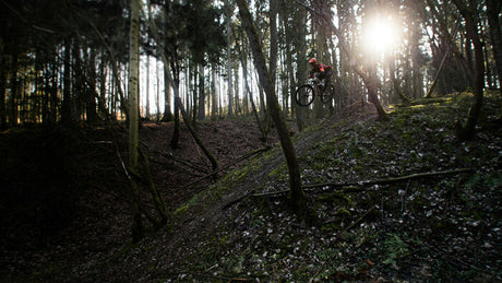 a person riding a bicycle off-road