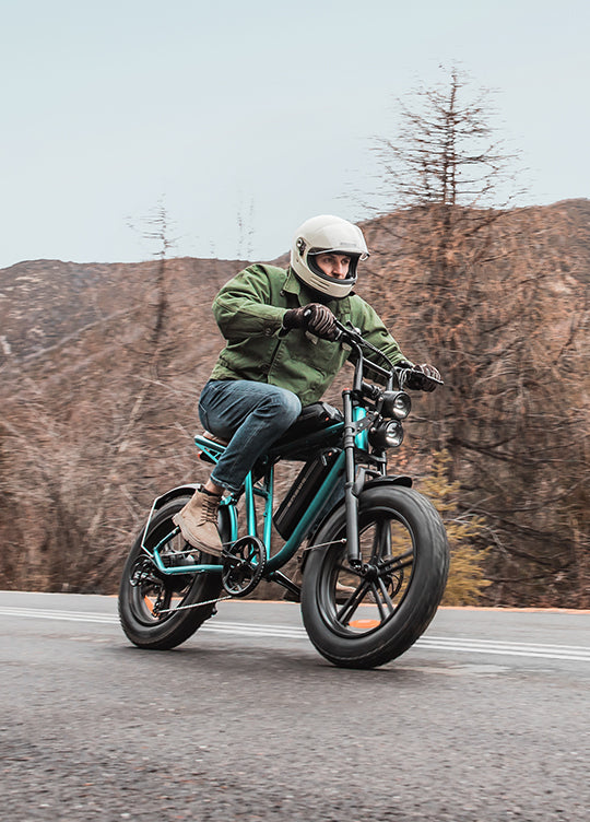A man wearing a helmet and riding a green engwe m20