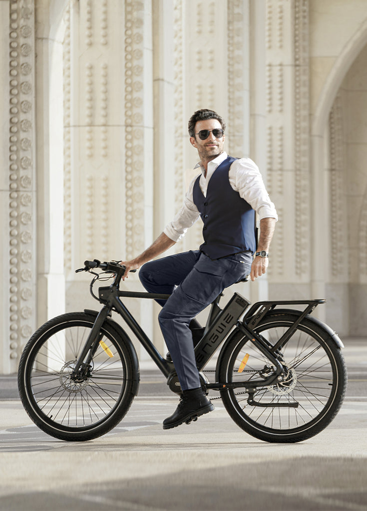 a man sitting on a black engwe p275 pro electric city bike